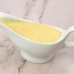 A sauceboat with white sauce.