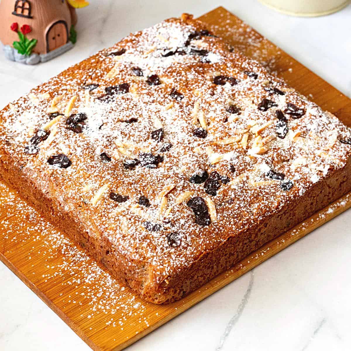 A square cake on the board.
