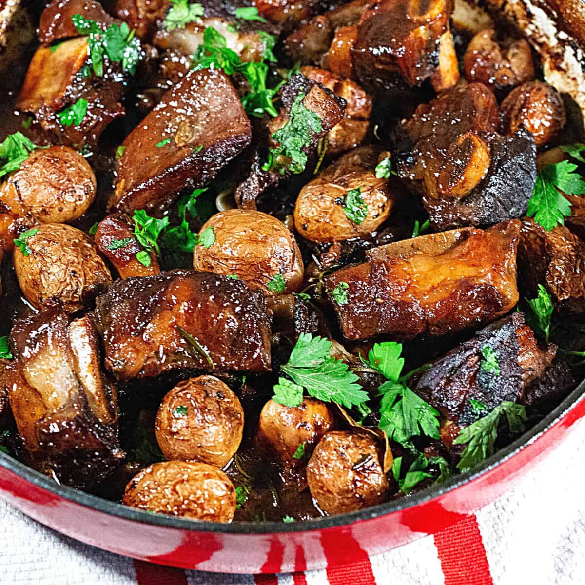 A casserole with short ribs and potatoes.