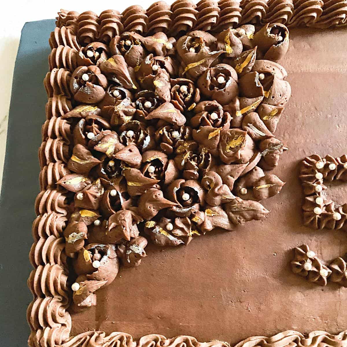 A sheet cake frosted with ganache.