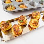 Potato stacks in a muffin tray.