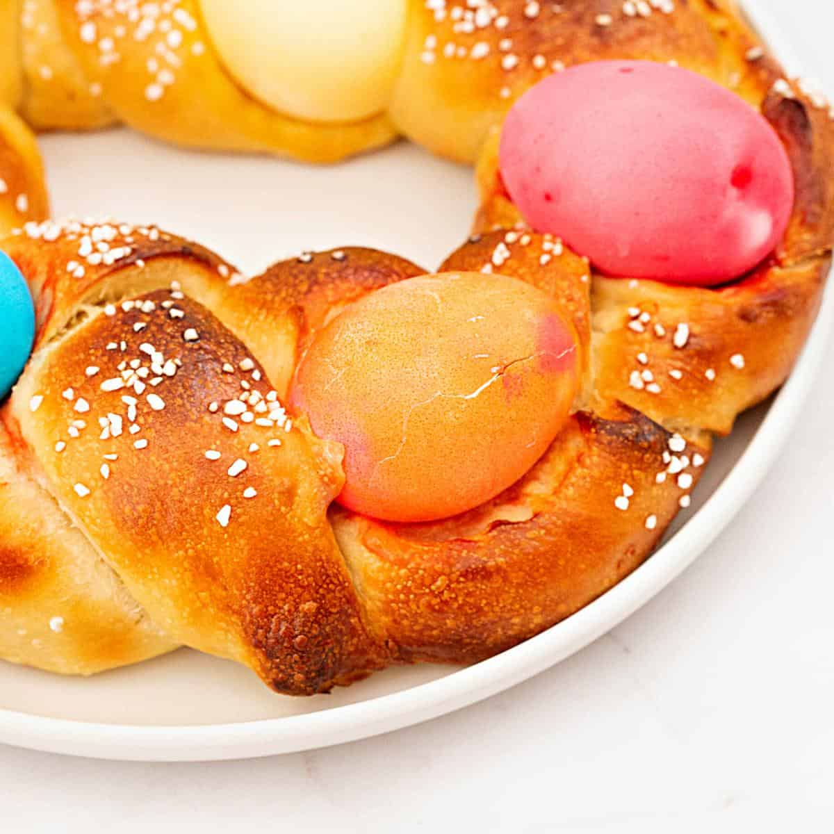 braided bread with dyed easter eggs.