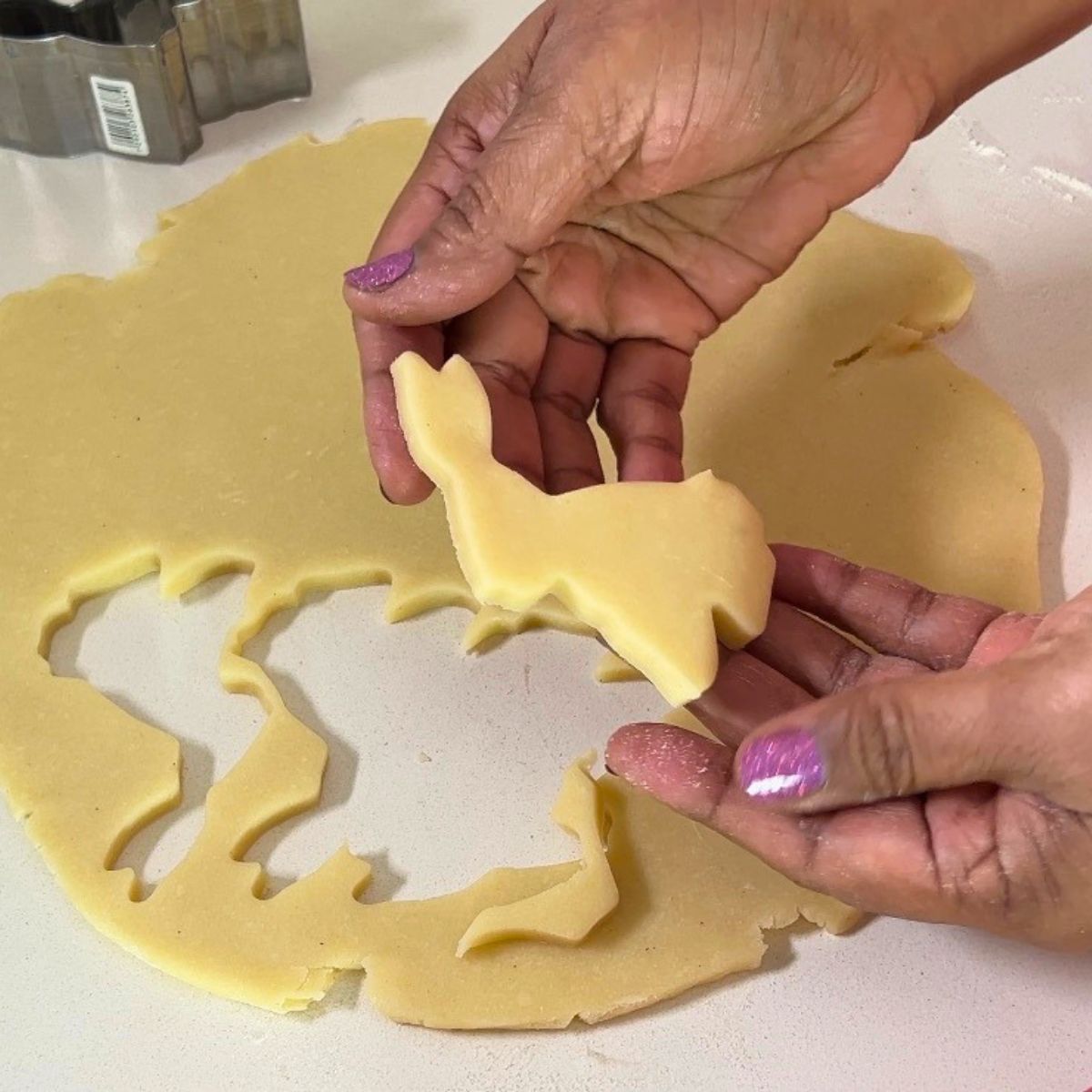 Bunny sugar cookie cut out on the table.