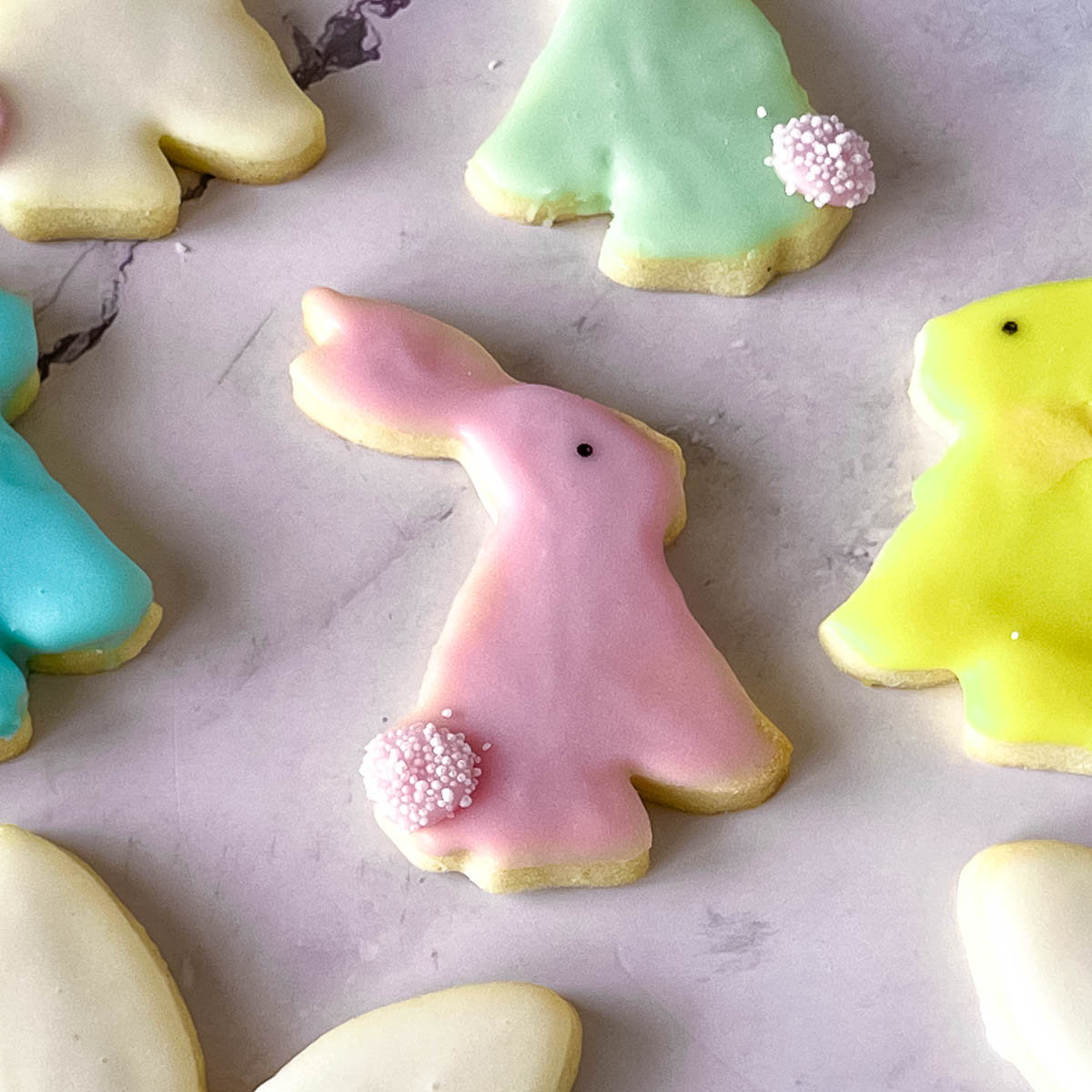 Pink bunny cookie on the table.