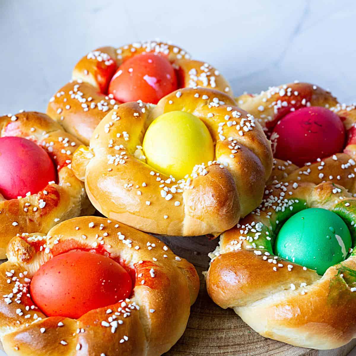 Stack of Italian bread with colored eggs.