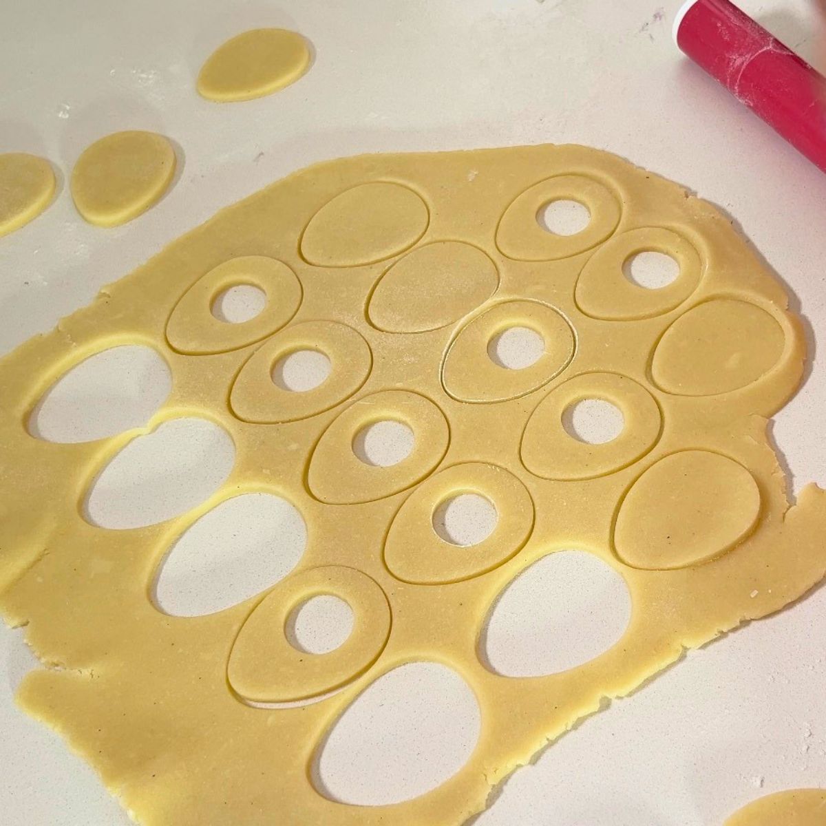 Sugar cookie cut outs on the table.