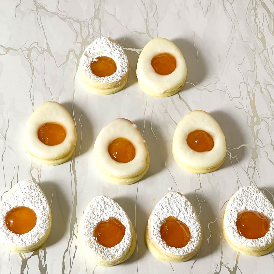 Easter Cookies with Apricot jam on table.