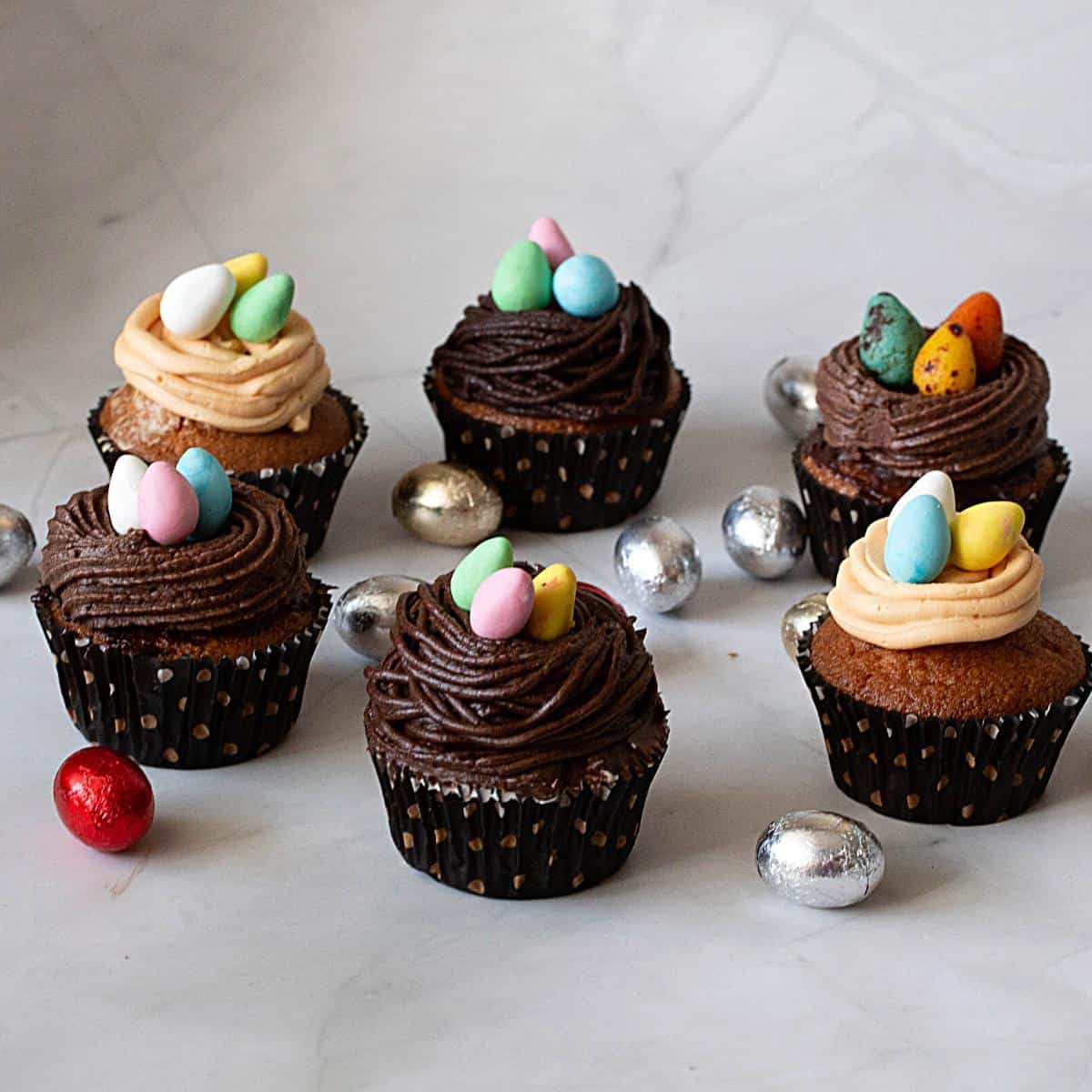 Easter cupcakes with candy eggs.