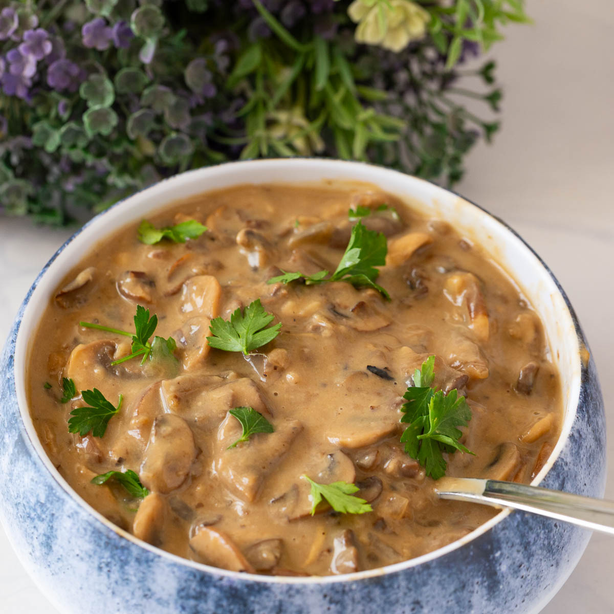 A bowl with mushroom steak sauce.