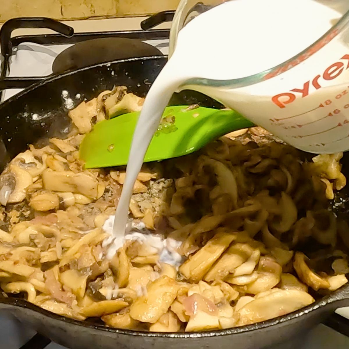 Progress pictures adding milk and cream to the mushroom sauce.