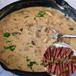 A skillet with mushroom sauce.