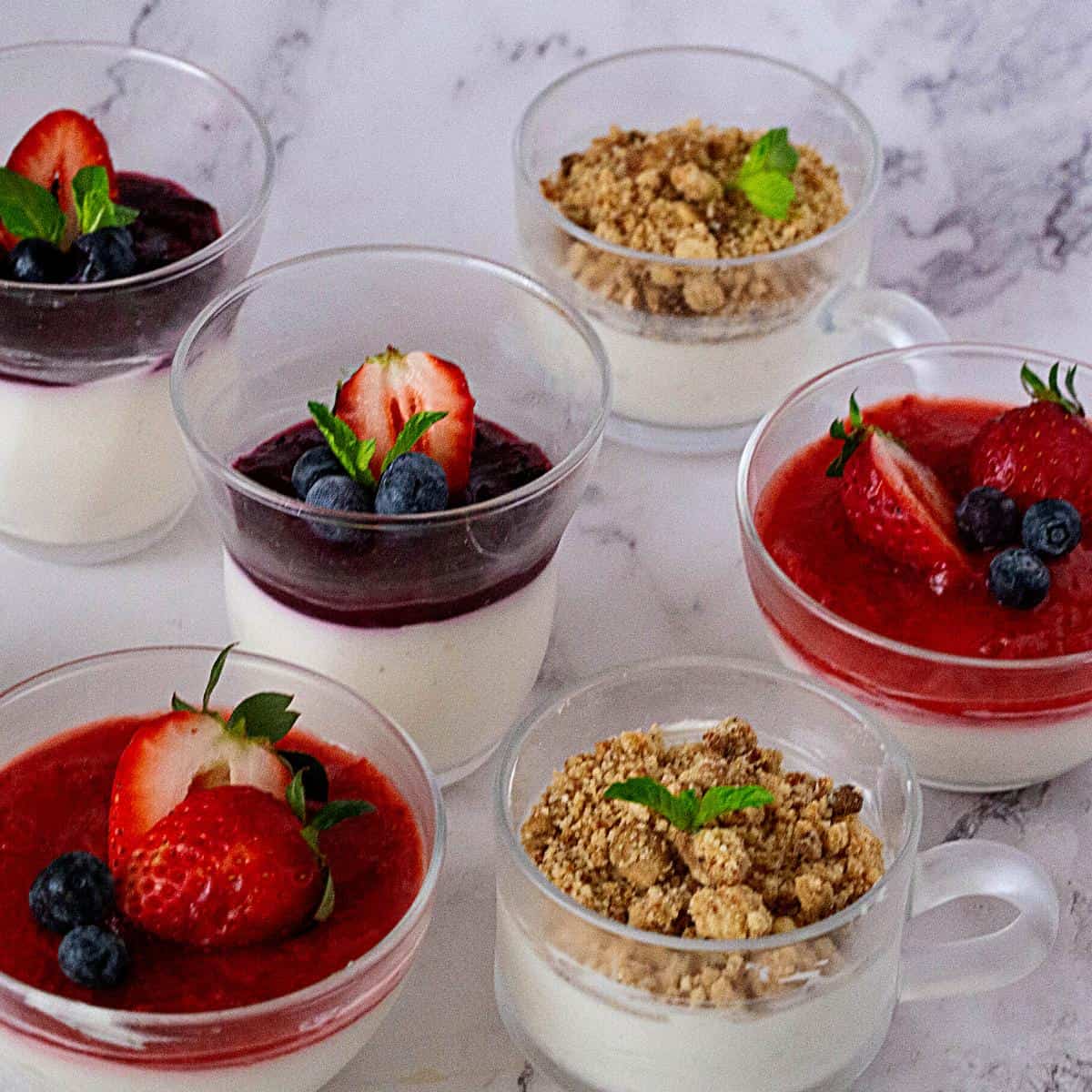 Bowls of cheesecake with toppings.