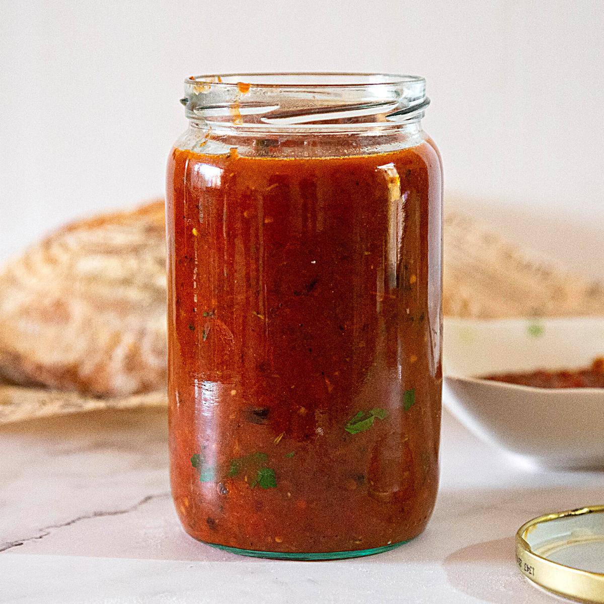 A jar with roasted tomato sauce.