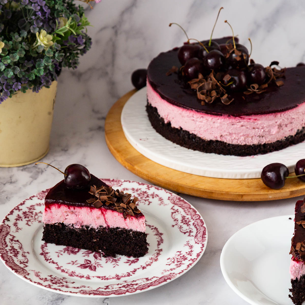 A slice of chocolate and cherry mousse cake.