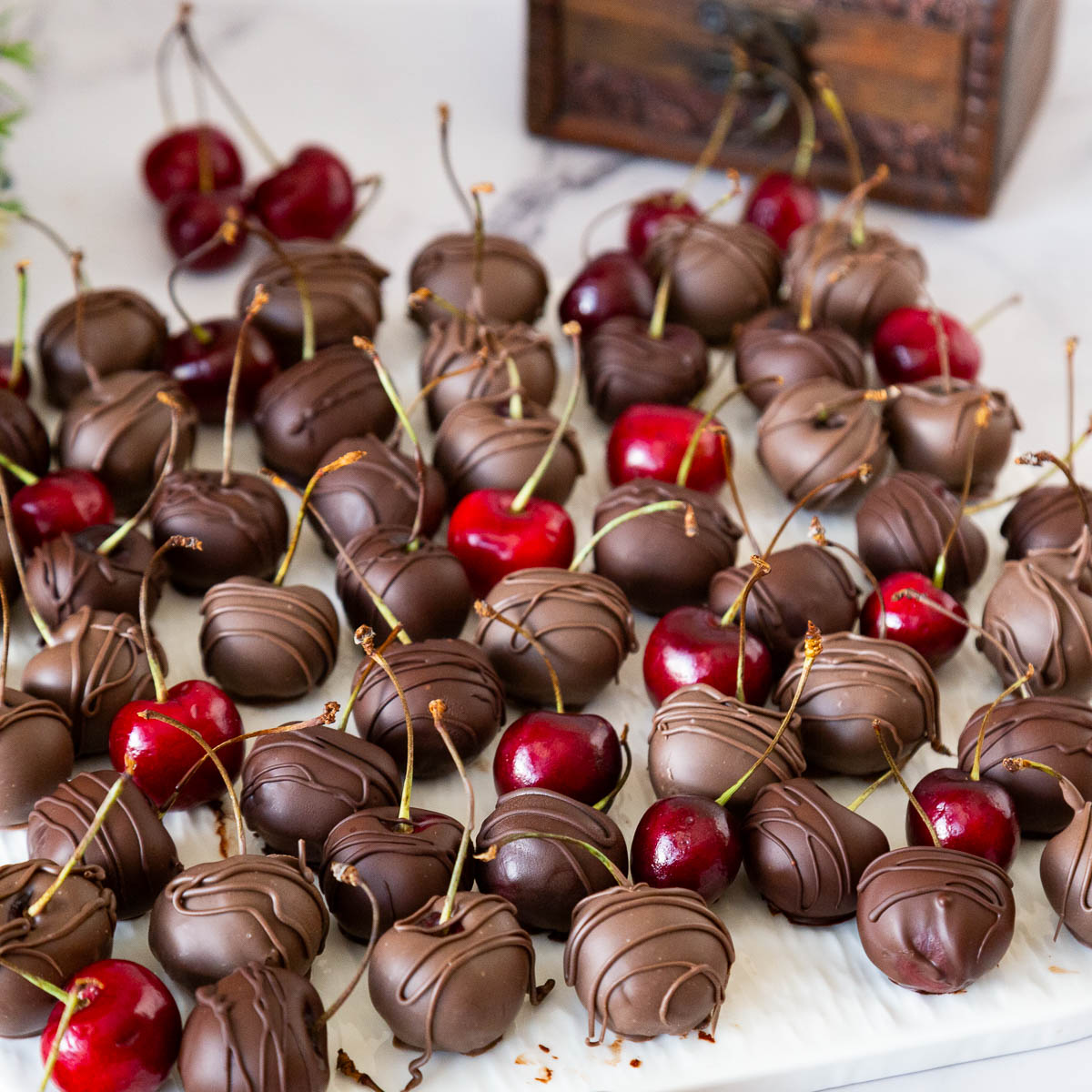 Plenty of cherries dipped in chocolate.