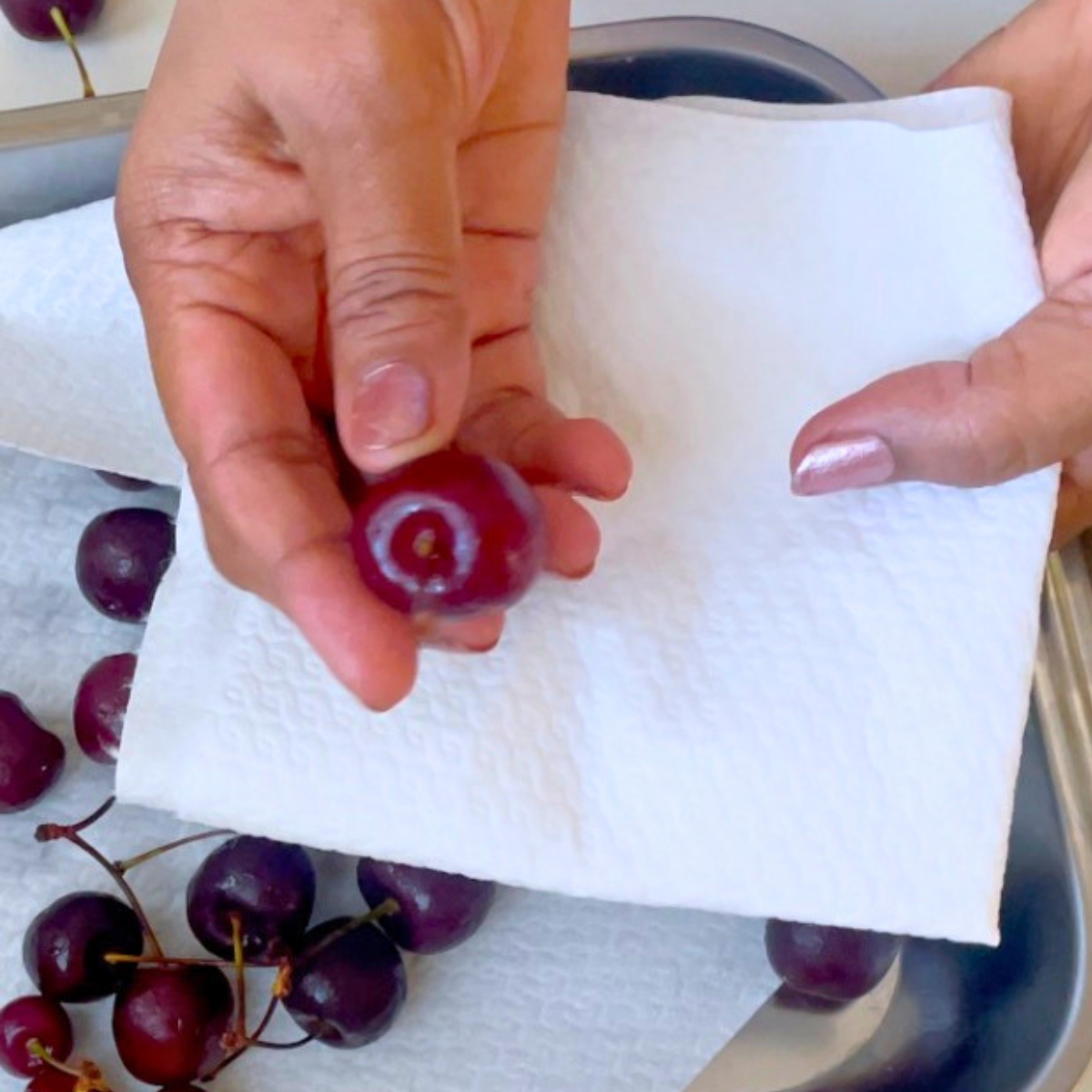 Whipping the cherries in chocolate before dipping