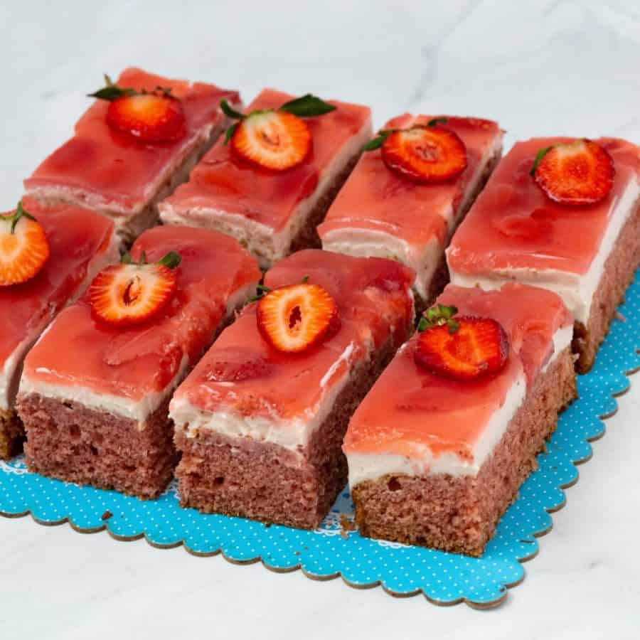 Strawberry dessert slices on the cake board.