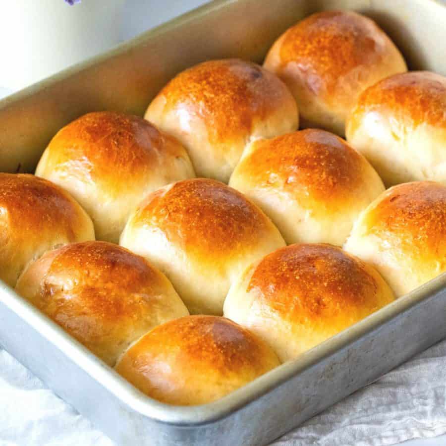 A pan with baked dinner slider rolls.