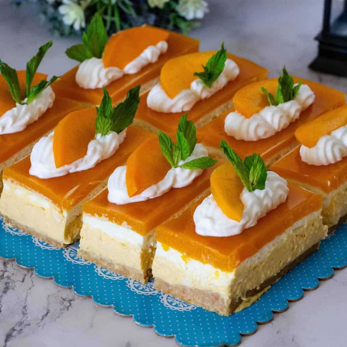 Dessert slices of mango cheesecakes.