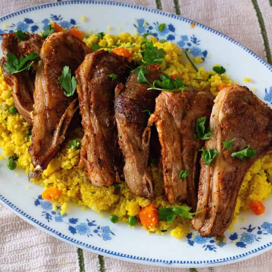 A platter with grilled lamb chops.