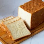 Slices of square sourdough sandwich bread.