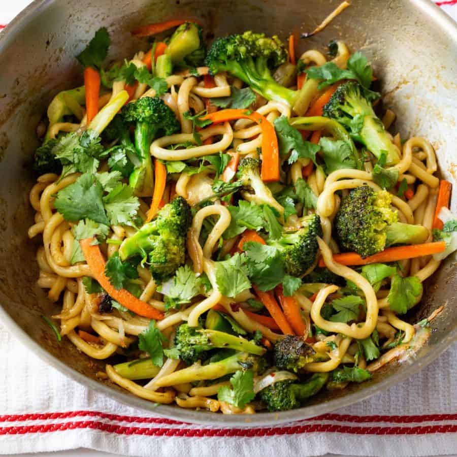 A wok with stir fry ramen.