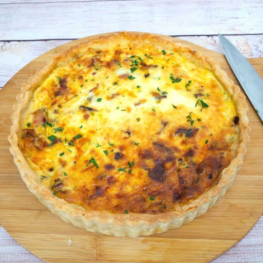 A baked quiche on the table.