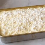 Sheet cake with coconut cake and frosting.