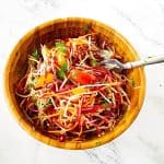 A salad bowl with vegetables.