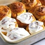 A baking dish with cinnamon rolls.