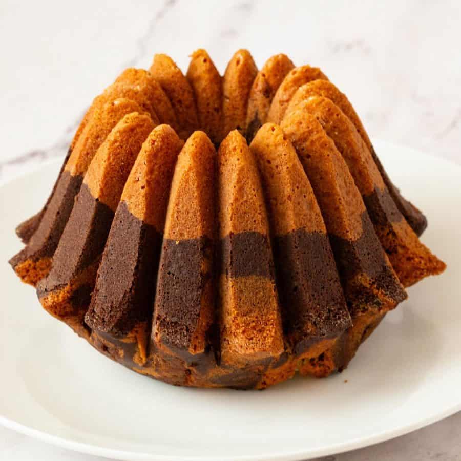 A baked bundt cake on the plate.