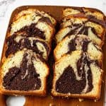 Slices of marble cake on a board.