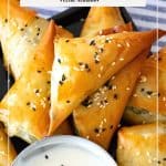 Pinterest image for spinach feta spanakopita triangles.