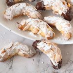 Crescent shaped cookies on a plate.