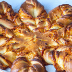 Golden baked bread on a platter.