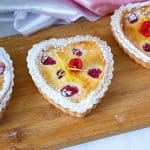 Heart-shaped tarts with lemon and raspberry.