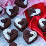 Chocolate cookie sandwiches on the table.