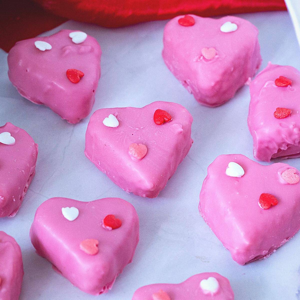 Heart shaped chocolates on the table.
