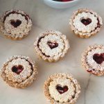 A few jam tarts on the table.