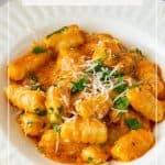 Pinterest image for leftover mashed potato gnocchi and tomato sauce.