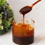 A glass jar with BBQ sauce recipe.