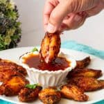 A bowl with chicken wings.