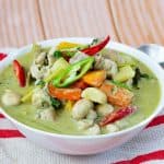 A serving bowl with Thai Green Curry chicken.