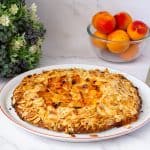 A baked apricot galette on the plate.