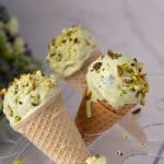 Ice cream cones with pistachio ice cream.