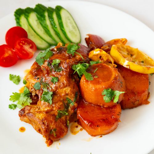 A chicken sweet potato meal on the plate.