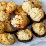 Macaroons on the table with fresh coconut.