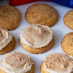 Frosted cinnamon cookies on the table.