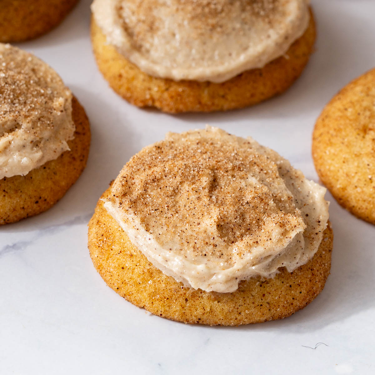 Frosted Cinnamon Sugar Cookies Churros on the table.