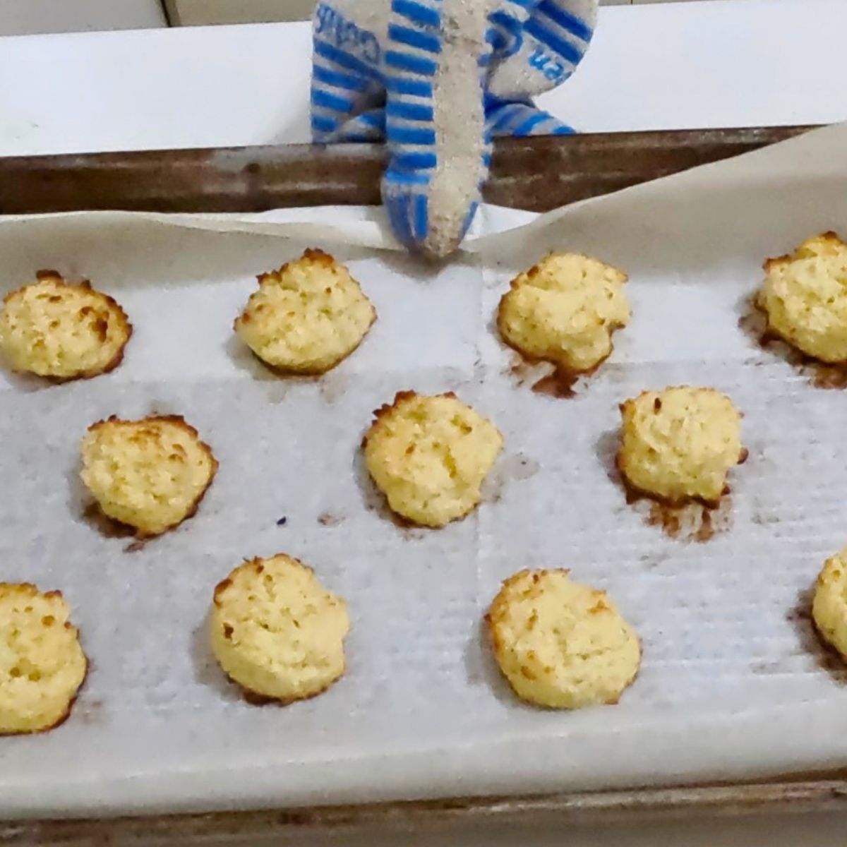 Baked macaroons on a tray.